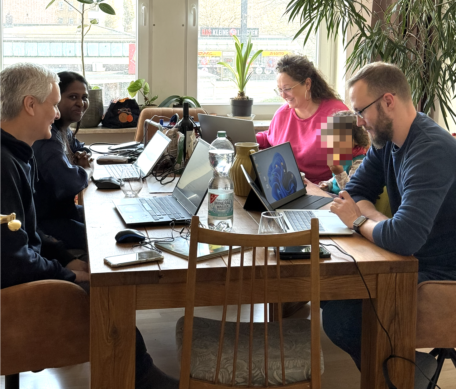 AI onboarding workshop with two product owners and two developers using the Keeper OS setup together at a shared table.